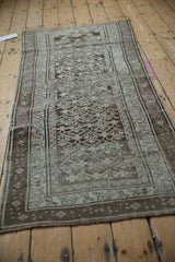 Distressed Caucasian runner with geometric lattice, showing silver, charcoal, and soft fuchsia tones.