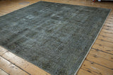 Worn texture of the overdyed vintage Sparta rug, with charcoal and oxidized silver tones.