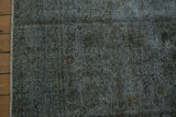 Distressed Sparta carpet texture with visible wear to foundation, charcoal, and oxidized silver.