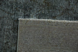 Woven foundation and distressed charcoal grey pile of a vintage Sparta rug.