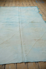 Diamond shaped lattice pattern and flatweave texture of a powder blue and ivory Kilim.