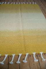 Handwoven Moroccan Rag Rug with abrash color striations of saffron yellow to pale gold.