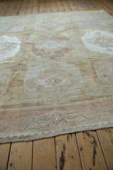 Distressed Kars carpet pile with faded beige, blush, and coffee tones, showcasing abrash and subtle patterns.