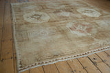 Worn side cord selvage and thin chevron zigzag border of the distressed Kars rug.