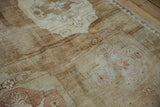 Distressed Kars carpet close-up showing worn pile texture and muted floral design.
