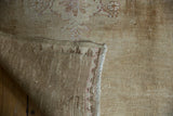 Vintage Kars carpet showing intact side selvage, tight foundation weave, and distressed pile.