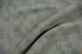 Distressed vintage Sparta rug, showing low pile texture and faded ivory slate lattice pattern.