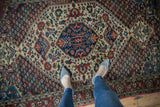 Overhead view showing the rich pattern and low-pile texture of the vintage Persian Baktiari rug.