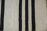 Hand woven Pakistani Kilim texture with varied horizontal silver and charcoal stripes.