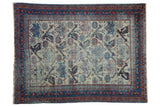 Vintage Afshar rug: antique ivory field, finned birds, geometric plants, sapphire blue, and madder red.