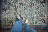 Vintage Afshar rug with sapphire blue, ivory, red geometric birds and plants, underfoot.