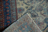 Folded Vintage Afshar rug reveals geometric sapphire blue, madder red patterns, fringe, hand-knotted foundation.