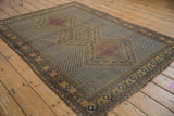 Antique Afshar rug corner with Herati stylized fish border, zigzag field, and visible edge wear.