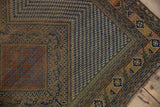 Antique Afshar rug corner, camel and navy geometric borders, with aged pile and tattered edge.