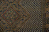 Detailed Afshar rug showing time-softened navy, camel, and green chevron patterns.