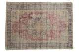 Vintage Kaisary rug with a scalloped medallion, Cyprus tree spandrels, and a worn red and teal palette.