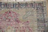Corner of a vintage Kaisary rug showing wear to foundation and Cyprus tree border design.