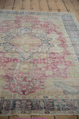 Timeworn texture of a vintage Kaisary rug with visible foundation and knot heads.