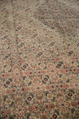 Time-softened blush and ivory tones across the low-pile Herati field of an antique Doroksh rug.