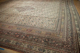 The intricate, multi-layered border and dense Herati field of an antique Persian Doroksh carpet.