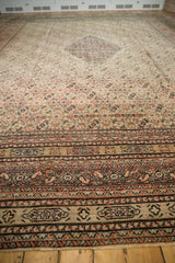 Angled view showcasing the grand scale and detailed border of an antique Doroksh Persian carpet.