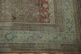 Distressed antique Bijar carpet corner with Herati motif, faded terracotta, and dusty teal borders.
