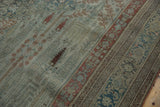 Distressed antique Bijar carpet: faded brick red Samovar Boteh border and dusty teal field.