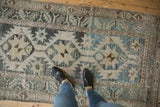 Distressed vintage Northwest Persian runner with primitive serrated starbursts in silver, blue, and beige abrash.