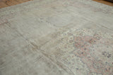 Distressed vintage Turkish Sparta carpet showing worn pile, exposed foundation, and blush motifs.
