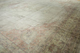 Distressed vintage Sparta carpet corner, dusty blush spandrel, wear to knot heads.