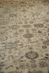 Beige field of vintage hand-knotted Agra rug, showcasing brown floral cross-sections and cloudbands.