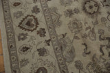 Egyptian Agra carpet with beige field, chocolate brown floral patterns, and border.