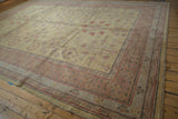 Khotan design carpet corner showing borders with pale cochineal red and oxidized silver.