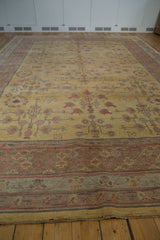 Original fringe, pale cochineal red, and oxidized silver border details of a Khotan design rug.