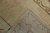 Distressed pile texture with subtle abrashes and durable hand-knotted foundation.