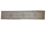 Distressed Pakistani Khotan runner, muted beige and mauve roundel medallions, scrolling border, 3' x 14'2