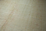 Soft distressed pile texture of a vintage Oushak rug with faint blush patterns.