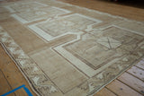 Vintage Kars carpet corner, geometric ivory and beige border, heavily abrashed field.