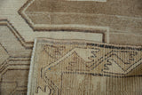 Reverse of vintage Kars hand-knotted carpet, showing tight weave with muted geometric patterns.