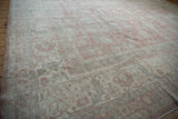 Vintage Distressed Sparta carpet with muted dusty rose floral patterns and worn texture.