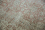 Distressed vintage Sparta rug pile with dusty rose, ivory, and pale slate vine floral pattern.