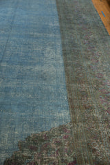 Distressed overdyed Khorassan carpet, showing the unique correction line with soft blue and teal tones.