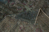 Distressed teal, green, and violet pile with foundation showing through on vintage Khorassan.