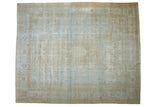 Distressed Mahal carpet, muted powder blue and beige, aged texture with traditional patterns.