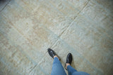 Textured distress on vintage Mahal carpet revealing muted beige and pale blue foundation.