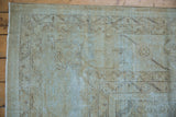 Worn texture and faint patterns on a distressed vintage Mahal rug, with dusty powder blue foundation.