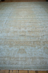 Detailed texture of distressed Mahal carpet, showing heavy wear to foundation, pale blue and beige.