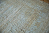 Heavily distressed texture of the vintage Mahal carpet, with visible foundation and muted beige.