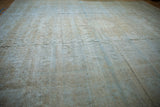 Distressed vintage Mahal carpet surface, highlighting worn pile, exposed foundation, and faded hues.