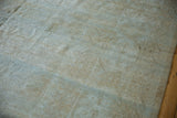 Distressed Mahal carpet with visible foundation, heavily worn texture, and muted tones.